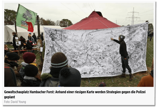 Screenshot Bild.de - Bildunterschrift - Gewaltschauplatz Hambacher Forst: Anhand einer riesigen Karte werden Strategien gegen die Polizei geplant