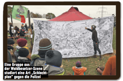 Ausriss Bild-Zeitung - Bildunterschrift - Eine Gruppe aus der Waldbesetzer-Szene studiert eine Art Schlachtplan gegen die Polizei